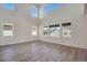 A bright living room with tall ceilings and many windows provides natural light at 24563 E 34Th Ave, Aurora, CO 80019