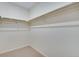 Empty walk-in closet featuring carpet flooring and installed shelving at 24563 E 34Th Ave, Aurora, CO 80019