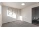 Bedroom featuring neutral carpet, paint, and a wall-mounted built-in bookshelf at 219 Terry St, Longmont, CO 80501