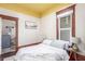 Serene bedroom with a comfortable bed and easy access to a convenient in-unit laundry at 219 Terry St, Longmont, CO 80501