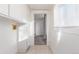 Laundry area with built-in cabinets and window at 219 Terry St, Longmont, CO 80501