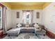 Comfortable living room with an oversized couch and a beautiful rug creates an inviting space at 219 Terry St, Longmont, CO 80501