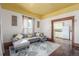 Living room with sectional sofa and view into the kitchen at 219 Terry St, Longmont, CO 80501