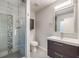 Updated bathroom with walk-in shower, toilet and vanity at 8340 E Princeton Ave, Denver, CO 80237