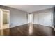 Hardwood floor bedroom with access to bathroom and closet at 8340 E Princeton Ave, Denver, CO 80237