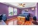 Stylish bedroom with hardwood floors, ceiling fan and window for natural light at 1086 Mockingbird St, Brighton, CO 80601