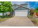 Charming home featuring a well-maintained yard, attached garage and light blue siding at 1086 Mockingbird St, Brighton, CO 80601