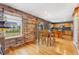 Open kitchen and dining area featuring wood floors, stainless appliances and wood cabinets at 1086 Mockingbird St, Brighton, CO 80601