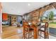 Open living room area featuring hardwood floors and large sliding doors to the yard at 1086 Mockingbird St, Brighton, CO 80601