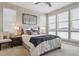 Bedroom with a large window, neutral colors, stylish lamps, and a comfortable bed at 3698 Penang Dr, Castle Rock, CO 80109