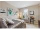 This bedroom features stylish décor, natural light from a window, and neutral tones for a serene atmosphere at 3698 Penang Dr, Castle Rock, CO 80109