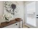 Entryway features a stylish console table with decor, modern art, and a door with privacy blinds at 3698 Penang Dr, Castle Rock, CO 80109