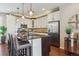 Bright kitchen with stainless steel appliances, granite countertops, and a central island at 3698 Penang Dr, Castle Rock, CO 80109