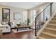 Sunlit living room features modern design, hardwood floors, and a cozy atmosphere with stylish furnishings at 3698 Penang Dr, Castle Rock, CO 80109