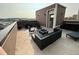 Spacious rooftop patio with stylish seating and an outdoor fireplace, offering a great space to unwind at 3698 Penang Dr, Castle Rock, CO 80109