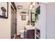Bright bathroom featuring a glass-door shower, modern vanity, and stylish decorative accents and fixtures at 1697 W Powers Ave, Littleton, CO 80120