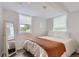 Bright bedroom with a large window and a full-length mirror at 1697 W Powers Ave, Littleton, CO 80120