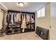 Organized walk-in closet filled with clothing, shoes, and accessories at 1697 W Powers Ave, Littleton, CO 80120