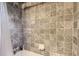 Tiled shower with neutral tones and new fixtures at 1697 W Powers Ave, Littleton, CO 80120