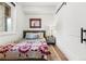 Cozy bedroom with a queen bed and a barn door at 2121 Hummingbird Way # 106, Georgetown, CO 80444