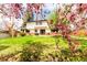 Expansive backyard with flourishing trees, verdant lawn, and inviting brick patio at 8736 E Easter Ave, Centennial, CO 80112
