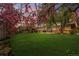 Expansive backyard featuring a lush lawn and a patio area, perfect for outdoor entertaining at 8736 E Easter Ave, Centennial, CO 80112