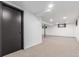 Bright basement featuring neutral carpet, fresh white paint, and recessed lighting at 8736 E Easter Ave, Centennial, CO 80112