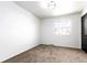 Bedroom with neutral carpet, a window, and a modern light fixture at 8736 E Easter Ave, Centennial, CO 80112