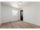 Cozy bedroom features a window, carpet, and neutral walls at 8736 E Easter Ave, Centennial, CO 80112