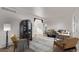 Bright living room with wood floors, a decorative cabinet, and stylish modern furniture at 8736 E Easter Ave, Centennial, CO 80112