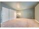 Spacious bedroom with neutral walls and ample closet space at 6702 S Ivy Way # A1, Centennial, CO 80112