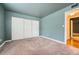 Well-lit bedroom featuring ample closet space at 6702 S Ivy Way # A1, Centennial, CO 80112