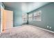 Bright bedroom with neutral walls and carpet at 6702 S Ivy Way # A1, Centennial, CO 80112