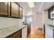 Kitchen features granite countertops and updated appliances at 6702 S Ivy Way # A1, Centennial, CO 80112