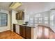 Bright kitchen with granite countertops and modern appliances at 6702 S Ivy Way # A1, Centennial, CO 80112