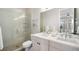 Modern bathroom with double vanity and glass shower at 5018 S Prince Pl, Littleton, CO 80123