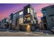 Modern three-story townhome with attached garage and stylish exterior finishes at 5018 S Prince Pl, Littleton, CO 80123