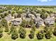 An aerial view shows the property's location in a neighborhood with mature trees and green spaces at 6449 S Jamaica Cir, Englewood, CO 80111