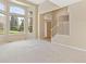 Bright and airy living room with vaulted ceilings, large windows, and neutral paint at 6449 S Jamaica Cir, Englewood, CO 80111