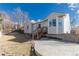 Spacious backyard with a patio area, lush lawn, and mature trees, creating a private outdoor oasis at 22815 E Progress Ave, Aurora, CO 80015