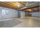 Basement view with exposed ceiling, concrete columns, and insulation, offering room for customization and expansion at 22815 E Progress Ave, Aurora, CO 80015
