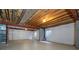 Exposed basement ceiling with beams, copper pipes, and an unfinished concrete floor, ready for customization at 22815 E Progress Ave, Aurora, CO 80015