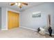 Bedroom with a ceiling fan, carpet flooring, and a large closet at 22815 E Progress Ave, Aurora, CO 80015