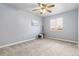 Neutral bedroom with a large window, ceiling fan, and carpet flooring at 22815 E Progress Ave, Aurora, CO 80015