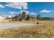 A vibrant community park featuring a basketball court, playground, and open green space, perfect for outdoor activities at 22815 E Progress Ave, Aurora, CO 80015