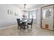 Charming dining area with neutral tile flooring, garden door, and views of the outdoors at 22815 E Progress Ave, Aurora, CO 80015