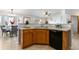 Open kitchen featuring ample counter space, wooden cabinetry, modern appliances, and convenient layout for cooking at 22815 E Progress Ave, Aurora, CO 80015