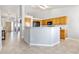 Bright kitchen with sleek countertops, modern appliances, and tile flooring, seamlessly flowing into the adjacent living areas at 22815 E Progress Ave, Aurora, CO 80015