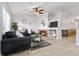 Inviting living room featuring a cozy fireplace, neutral tones, and stylish decor, creating a warm atmosphere at 22815 E Progress Ave, Aurora, CO 80015