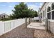 Charming backyard with beautiful lake views and a stone walkway near the house at 15555 E 40Th Ave # 36, Denver, CO 80239